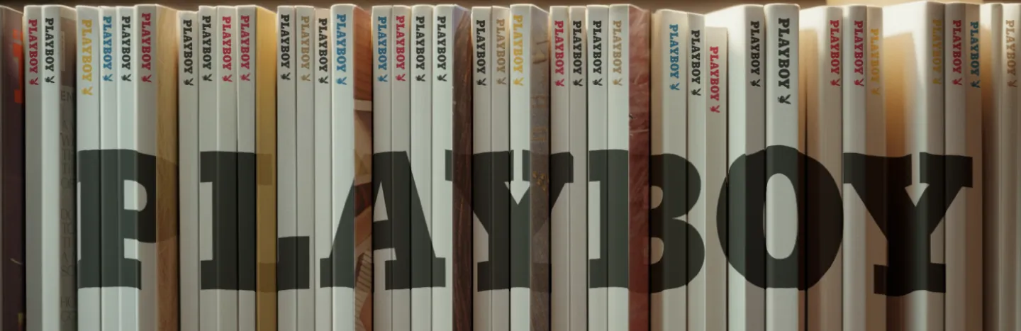 A bookshelf of playboy issues that spells out Playboy.