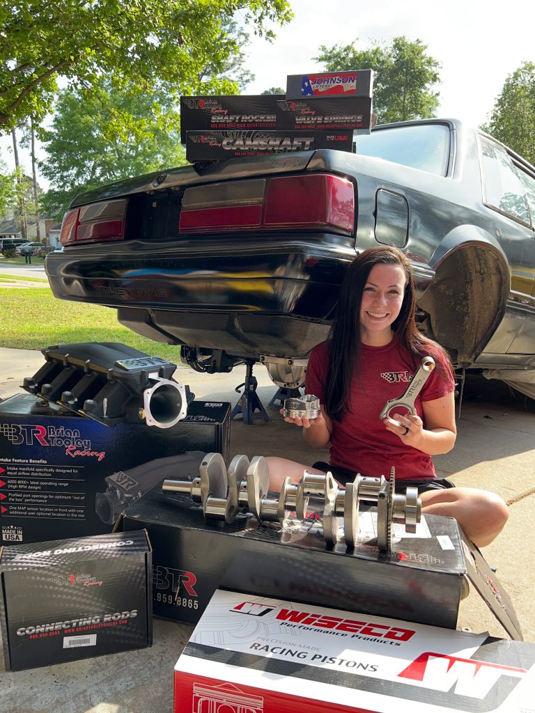 Racin' Payton working on a car