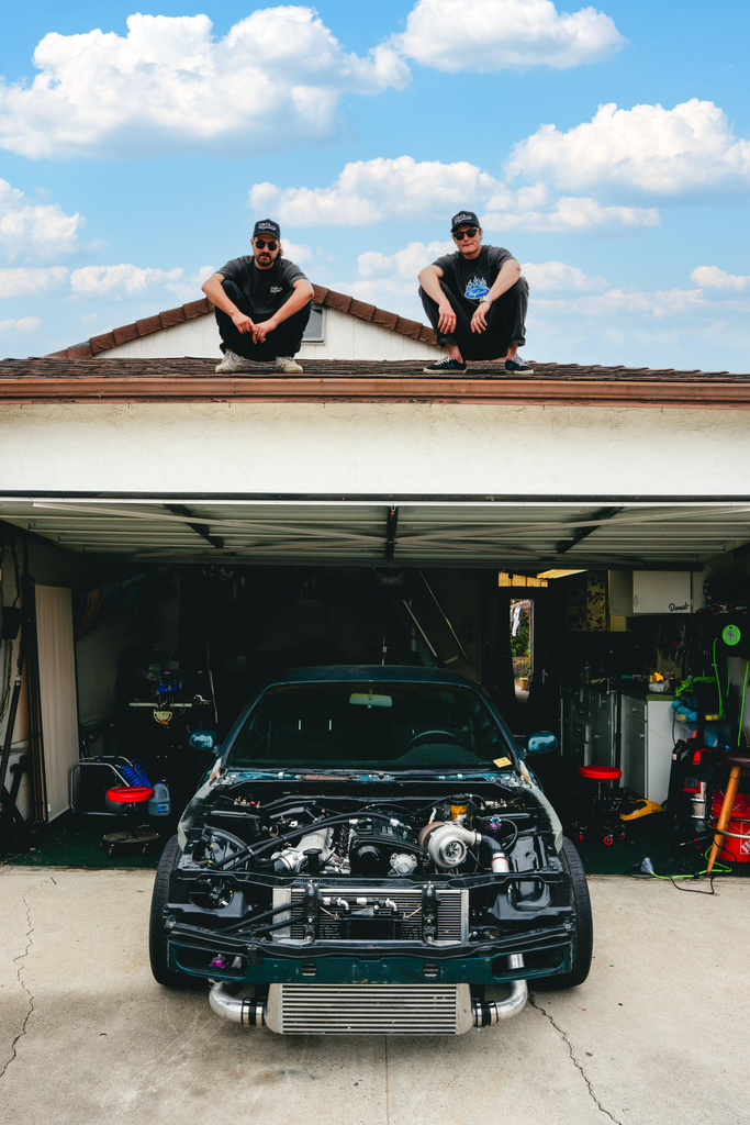 BigTime's Jeremiah and Zack standing atop their garage