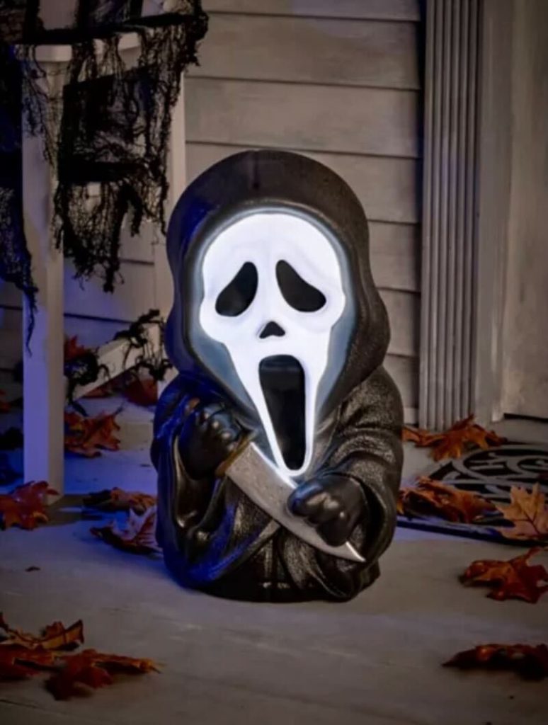 Welcome trick-or-treaters with a scary surprise using this officially licensed Ghost Face Light-Up Porch Buddy! This light-up Ghost Face decoration is complete with a glowing interior that adds an extra layer of spookiness to your porch or entryway. Get ready to give your guests a Halloween scare they won't forget!