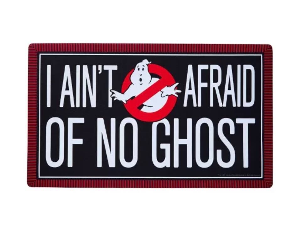 Welcome guests with a touch of nostalgia and celebrate your favorite movie series when you get this officially licensed Ghostbusters doormat. Featuring the iconic Ghostbusters logo and the phrase "I Ain't Afraid of No Ghost," this decoration is sure to keep the ghouls away and put a smile on every visitor's face.