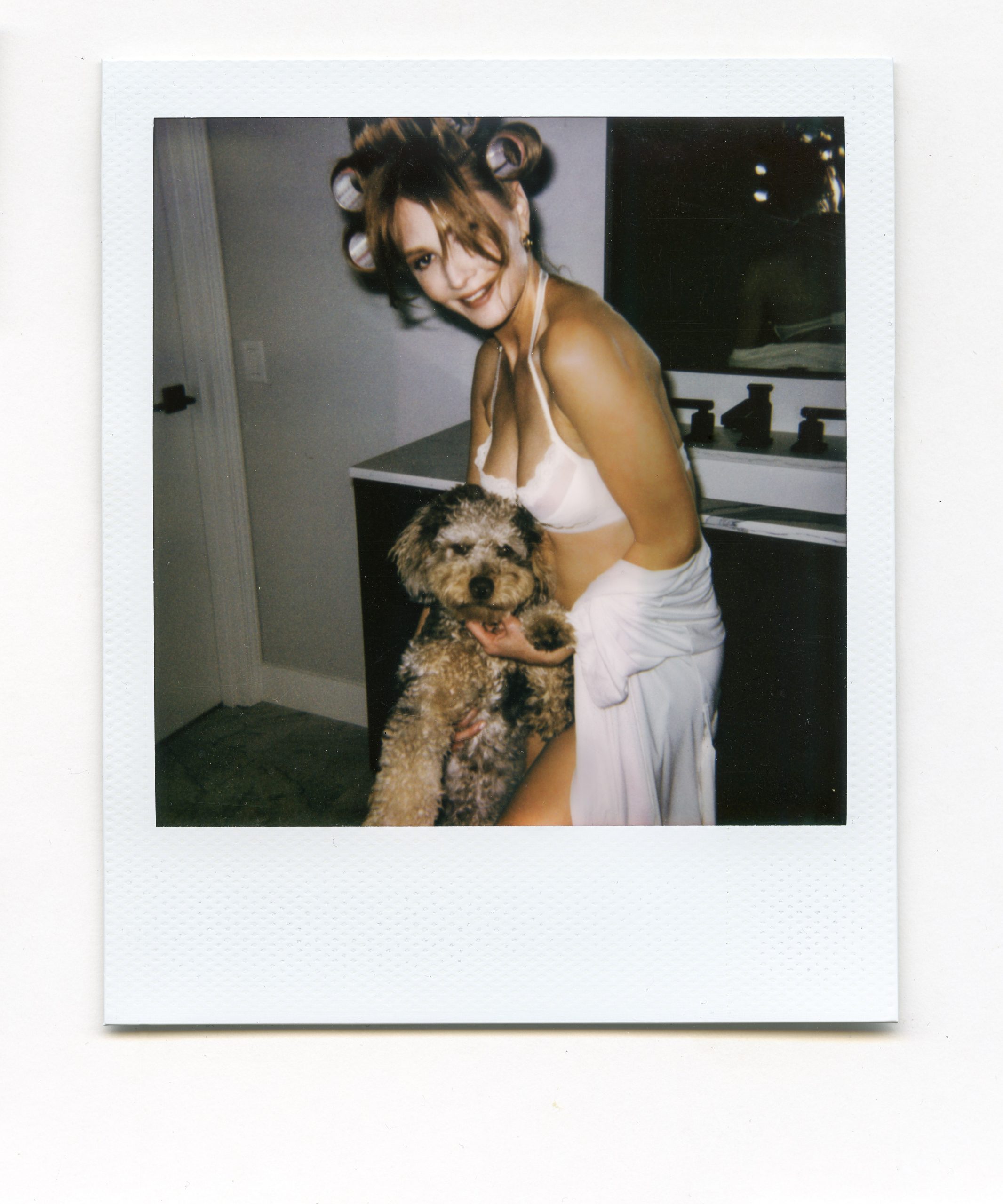 Dominique Jane in white lingerie with dog.