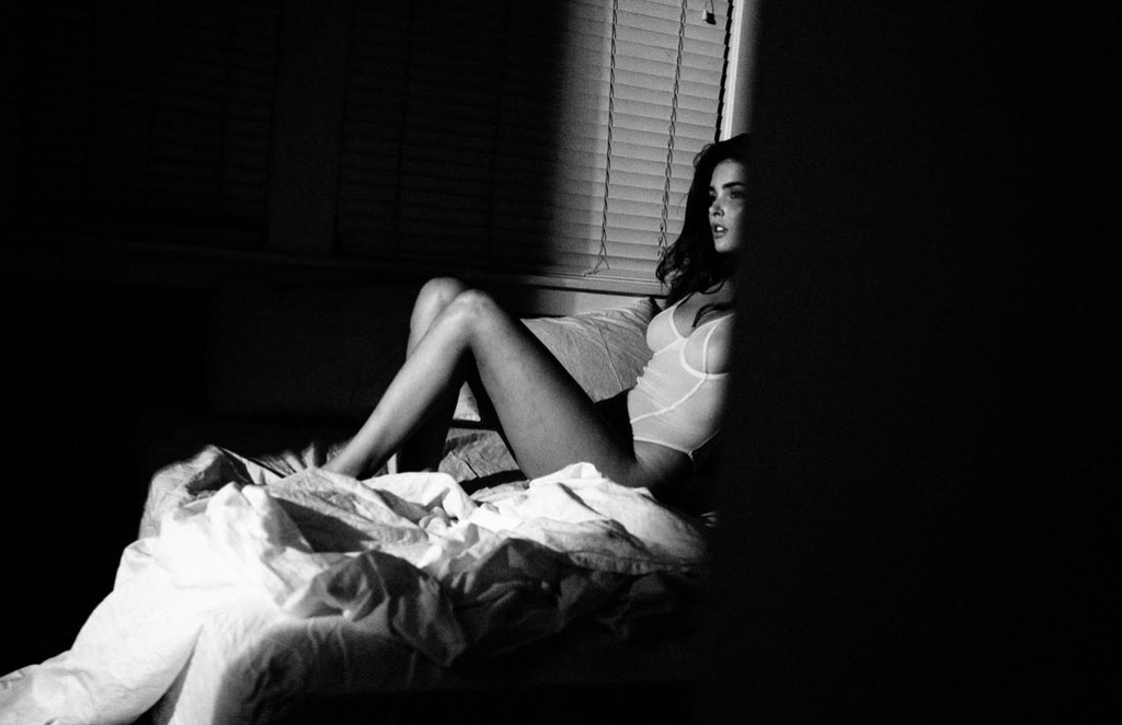 Jessica Wall on bed black and white