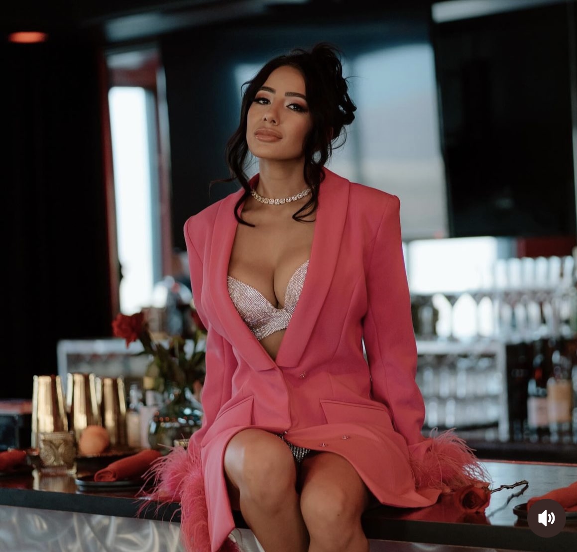 Danielle in pink business suit.