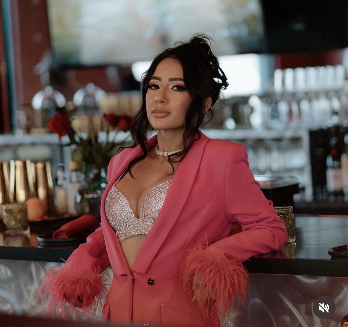 Danielle in pink business suit.